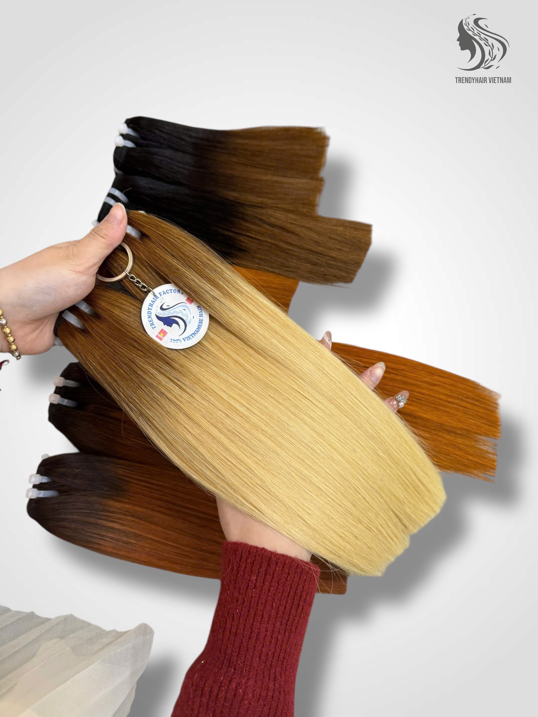 Woman maintaining Vietnamese bone straight hair with hair care products