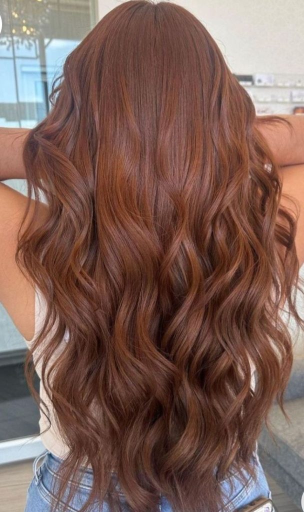 Model with stunning red-brown hair color for fall