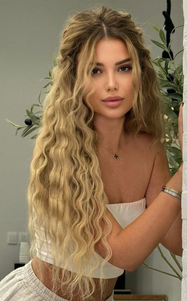 Woman with trendy curly hairstyle from Curly Hair Trends 2025