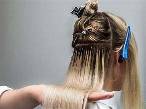 Woman showing before and after Hair Extension Transformations